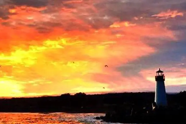 a sunset over a body of water